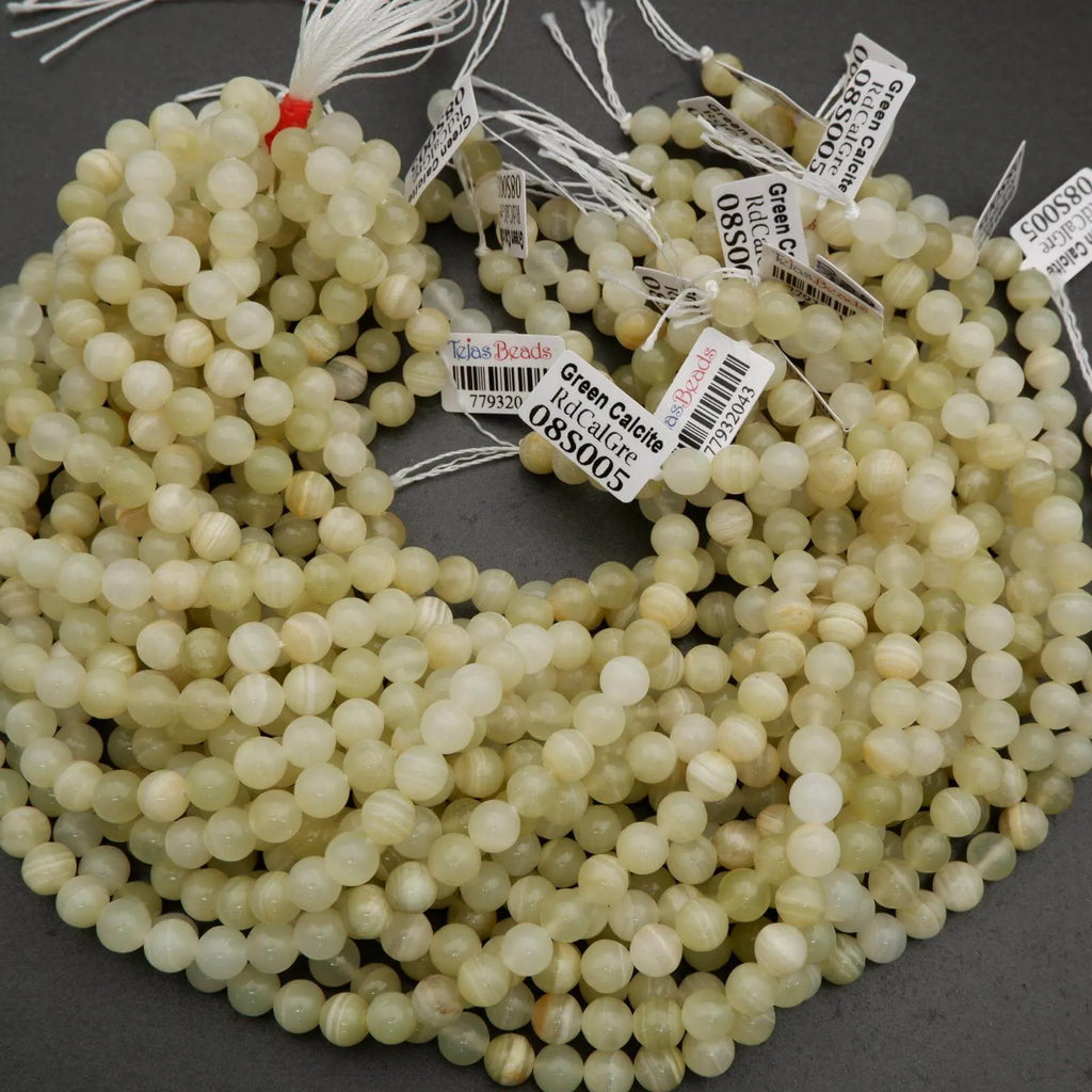 Yellowish green beads with subtle banding.