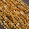 Close-up of amber-colored beads on a gray background
