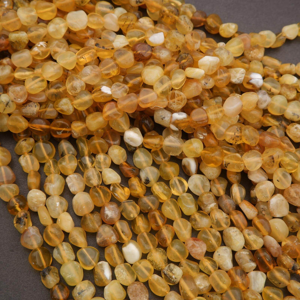 Close-up of amber-colored beads on a dark background