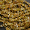 Close-up of small yellow and green stones on a dark background