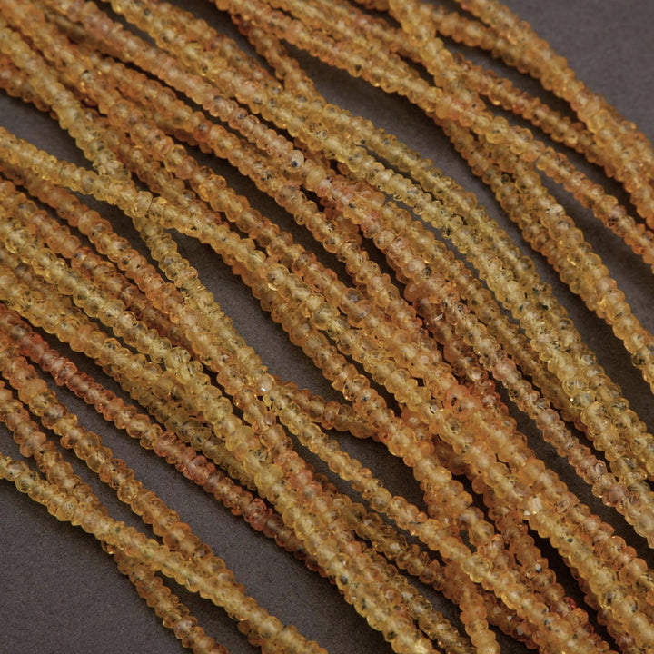 Close-up of amber-colored beads on a dark background