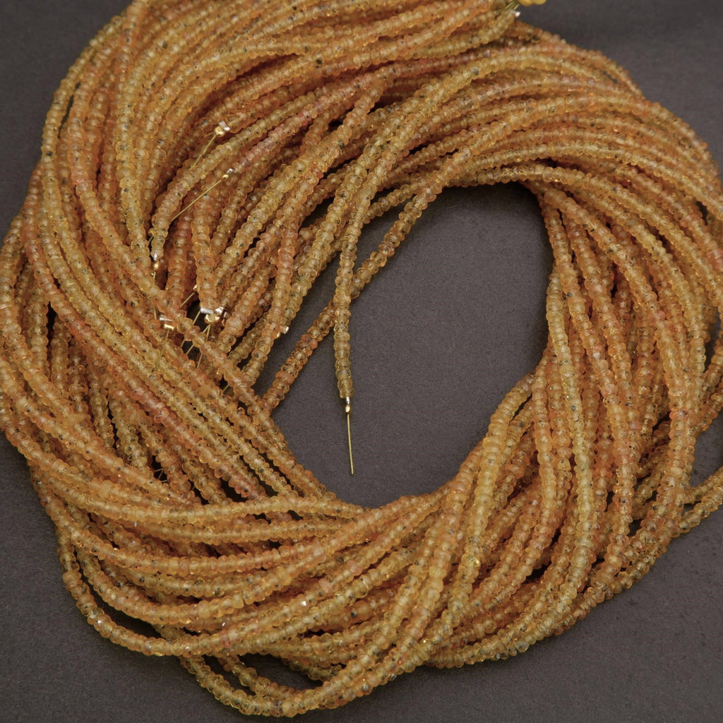 Coiled brown rope with a needle on a dark background