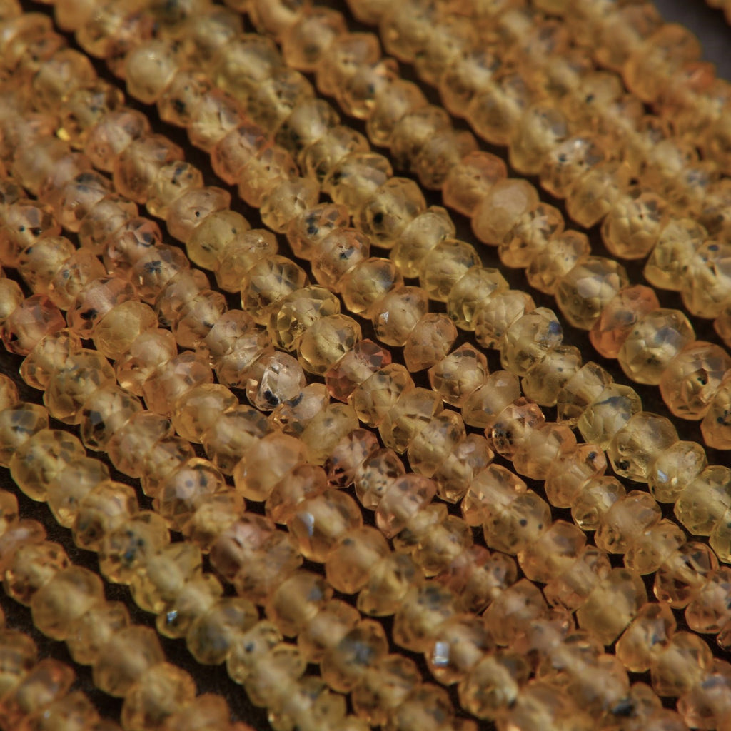 Close-up of amber-colored beads on a string