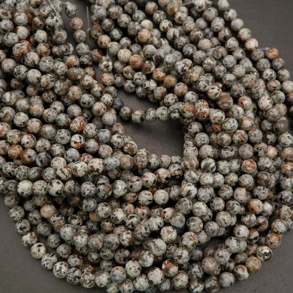 Close-up of a string of round beads with a gray background