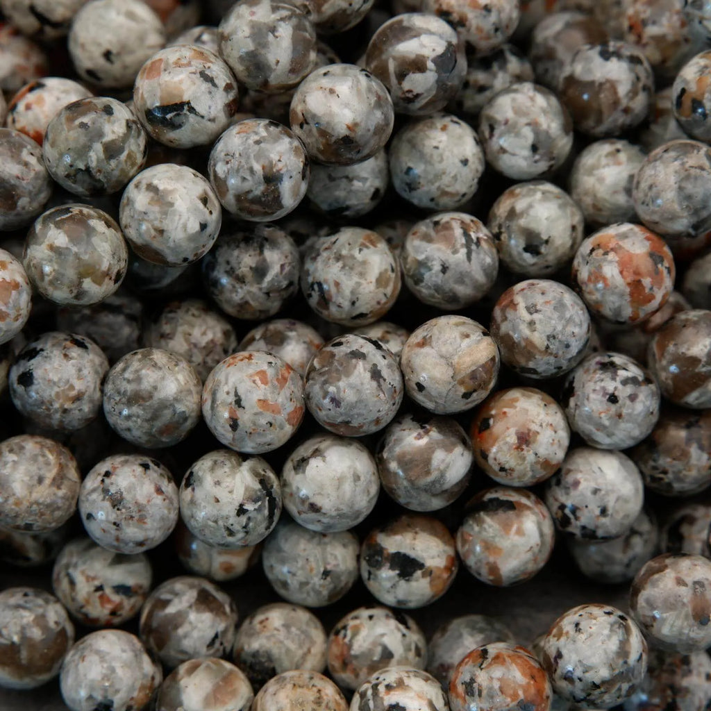 Close-up of a pile of small, round, multicolored stones.