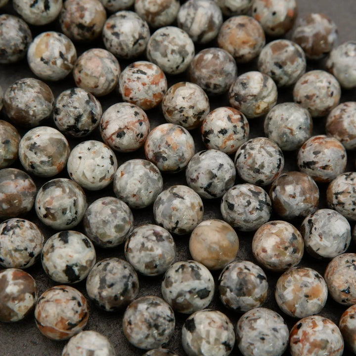 Close-up of a pile of small, round, multicolored stones.
