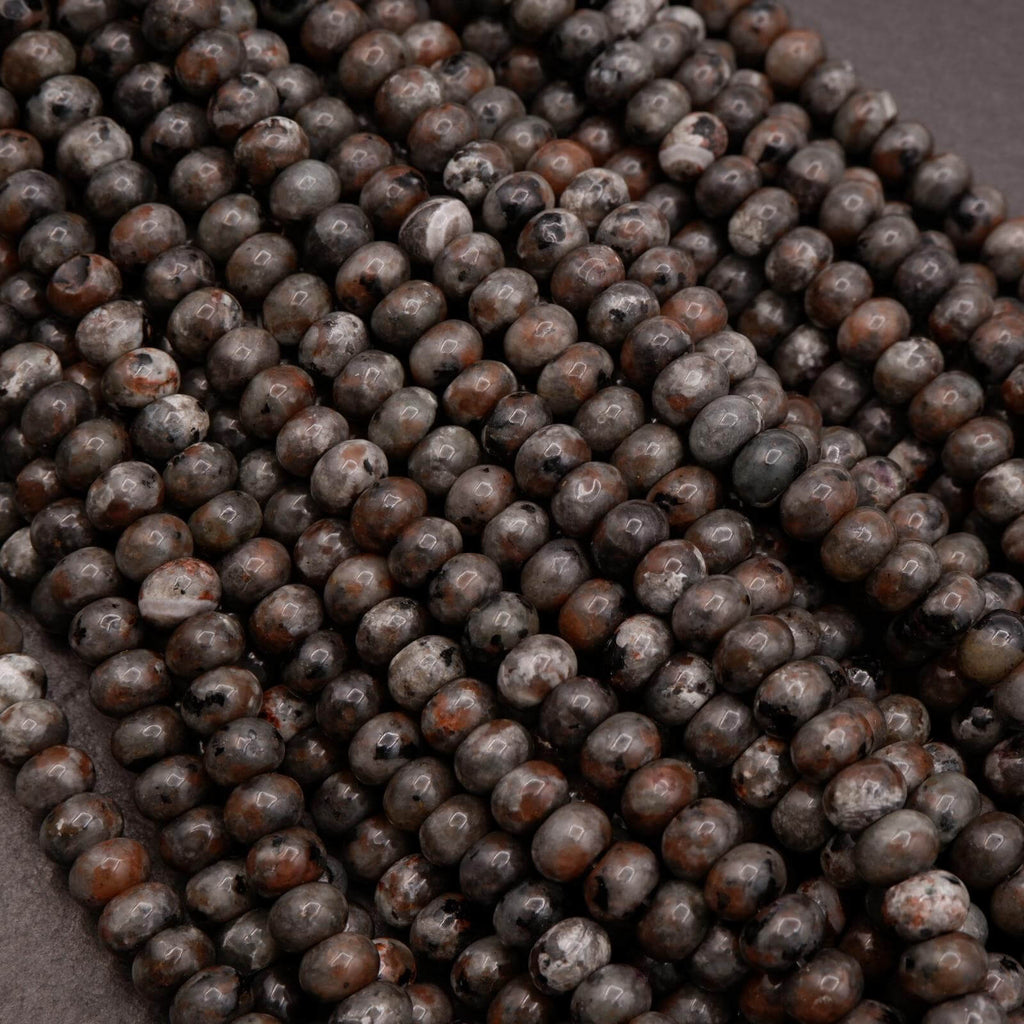 Detailed view of Yooperlite beads showing natural mottling and inclusions