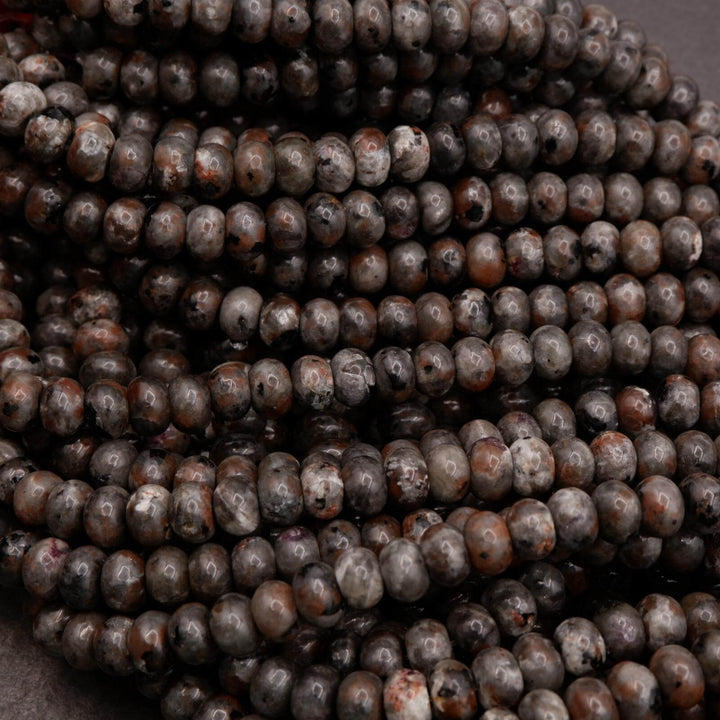 Close-up of Yooperlite beads highlighting surface polish and color variation