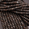 Yooperlite rondelle beads in dark gray and brown tones, polished and strung
