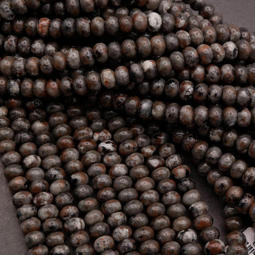 Yooperlite rondelle beads in dark gray and brown tones, polished and strung