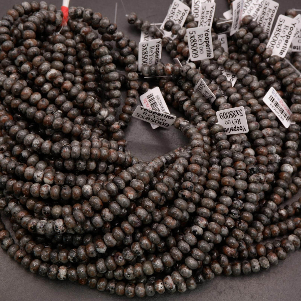 Yooperlite rondelle beads in dark gray and brown tones, polished and strung