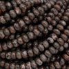 Yooperlite rondelle beads in dark gray and brown tones, polished and strung