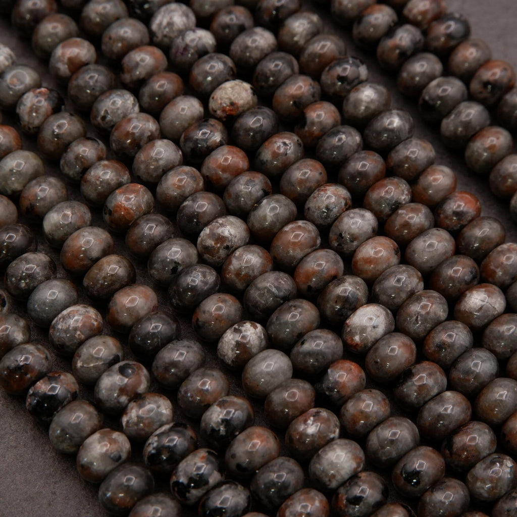 Strands of Yooperlite rondelle beads laid flat