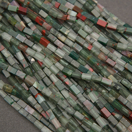 African bloodstone rectangular beads featuring forest green, smoky gray, and deep red mineral patterns.