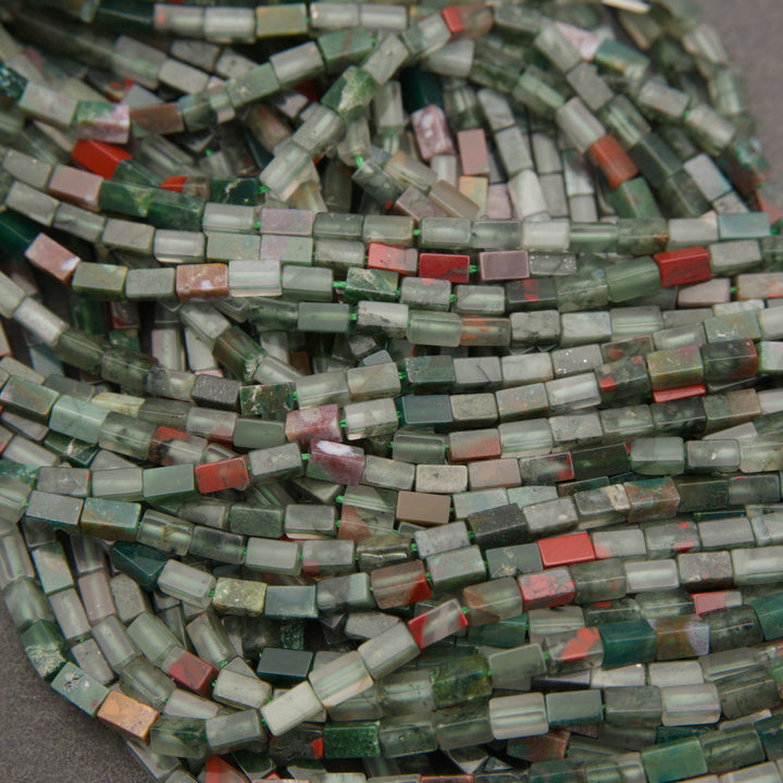 Natural African bloodstone gemstone tube beads with muted green tones and contrasting brick-red patches.