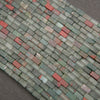 Strands of rectangular African bloodstone beads with varied sage green, gray, and reddish-brown markings.