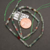African bloodstone gemstone beads featuring polished rectangular shapes and natural multicolored patterns.