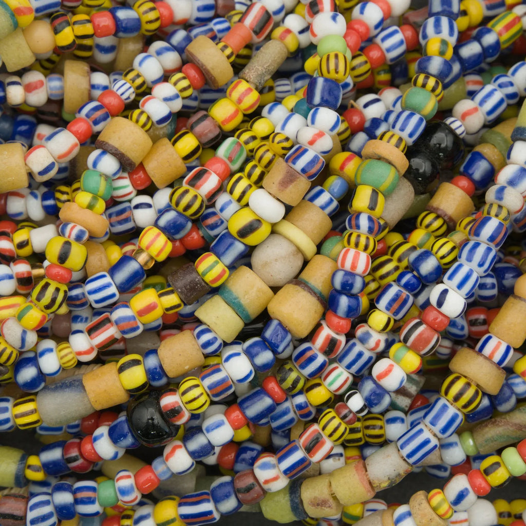 Close-up of colorful glass beads in various patterns and colors.