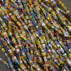 Close-up of colorful beads on a dark background