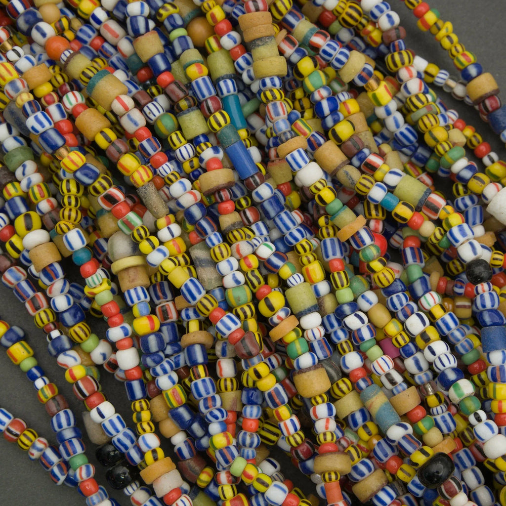 Close-up of colorful beads on a dark background