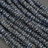 Close-up of dark fabric with white speckles on a gray background