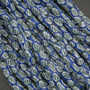Close-up of blue and green patterned rope on a dark background