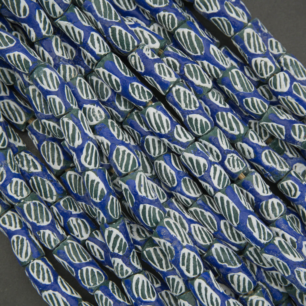 Close-up of blue and green patterned rope on a dark background