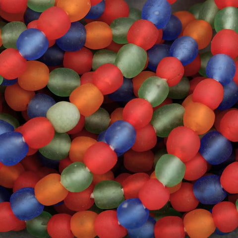 Close-up of colorful glass beads in red, blue, and green.