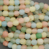 Close-up of pastel-colored beads on a gray background
