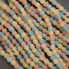 Close-up of pastel-colored beads on a dark background