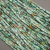 Small African turquoise gemstone tube beads in shades of blue-green, olive, and sandy brown.