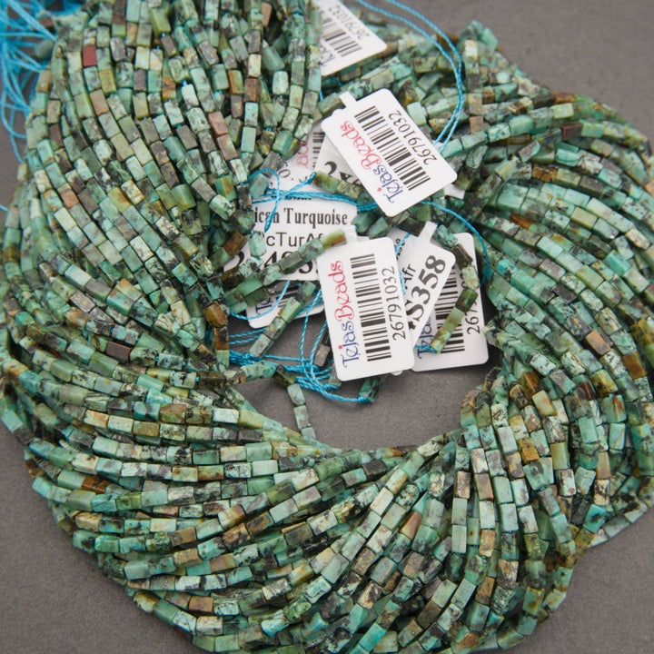 Close-up of African turquoise jasper beads displaying natural-looking mottled patterns and varied green tones.