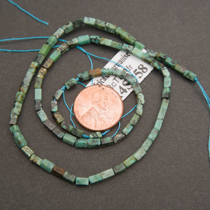 African turquoise jasper gemstone beads featuring mint green, aqua, and earthy gray-brown markings.