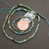 African turquoise jasper gemstone beads featuring mint green, aqua, and earthy gray-brown markings.
