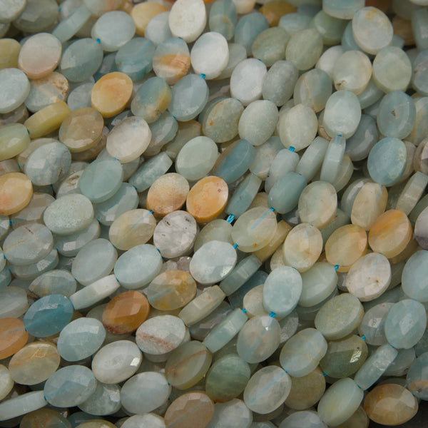 Close-up of faceted amazonite oval beads with aqua, cream and peach patches