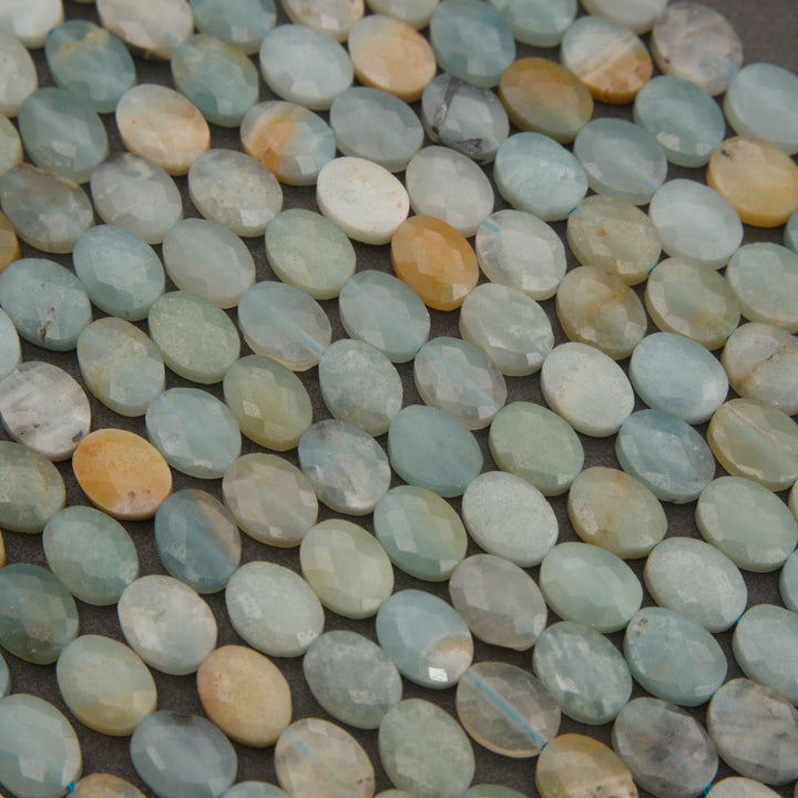 Close-up of flat faceted amazonite oval beads in seafoam and sky blue