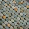 Close-up of flat faceted amazonite oval beads in seafoam and sky blue