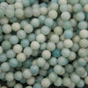 Polished amazonite round beads featuring soft aqua blue, seafoam green, and creamy white tones with natural color variations.