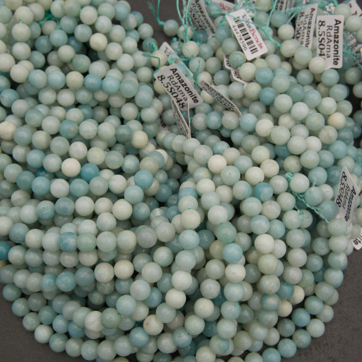Natural amazonite beads featuring soft blue and green coloring with subtle white mineral patterns for jewelry making.