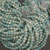 Natural amazonite beads featuring soft blue and green coloring with subtle white mineral patterns for jewelry making.