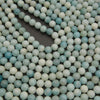 Pale blue amazonite gemstone beads with a smooth finish and gentle color variations for handmade bracelets and necklaces.
