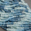 Close-up of blue beads on a gray background