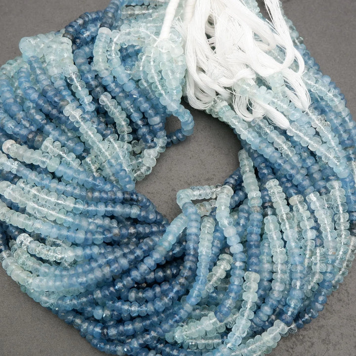 Close-up of blue and white beads on a gray surface