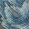 Close-up of blue beads on a gray background