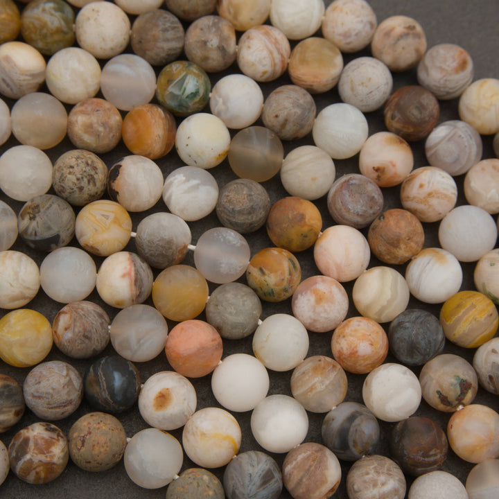 Matte Bamboo Leaf Agate beads with earthy natural color variation
