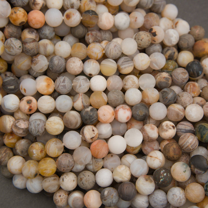 Strands of Bamboo Leaf Agate round beads in neutral earthy shades