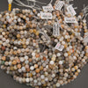 Close-up of Bamboo Leaf Agate beads with cream, brown, and gray markings