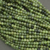 Green jade spacer beads smooth round shape with dark speckling