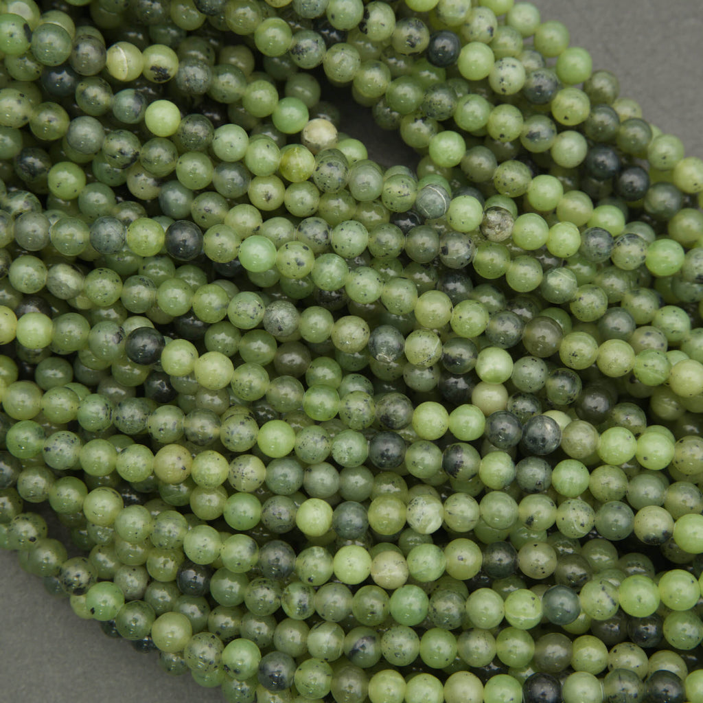 Green jade spacer beads smooth round shape with dark speckling