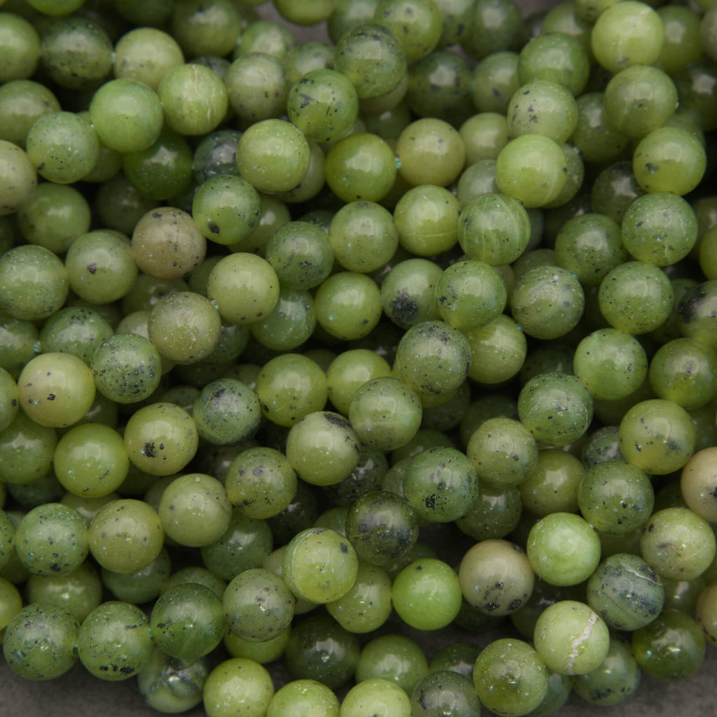 Round light green jade beads.